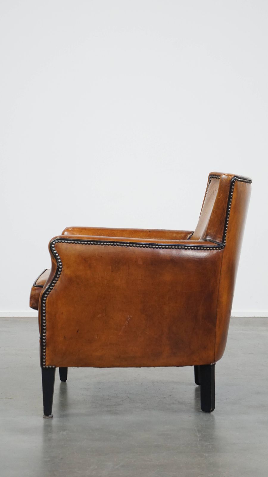 Subtle Cognac Colored Sheepskin Armchair With A Nice Design And Finish With Black Piping And Decorative Nails photo 952.2207
