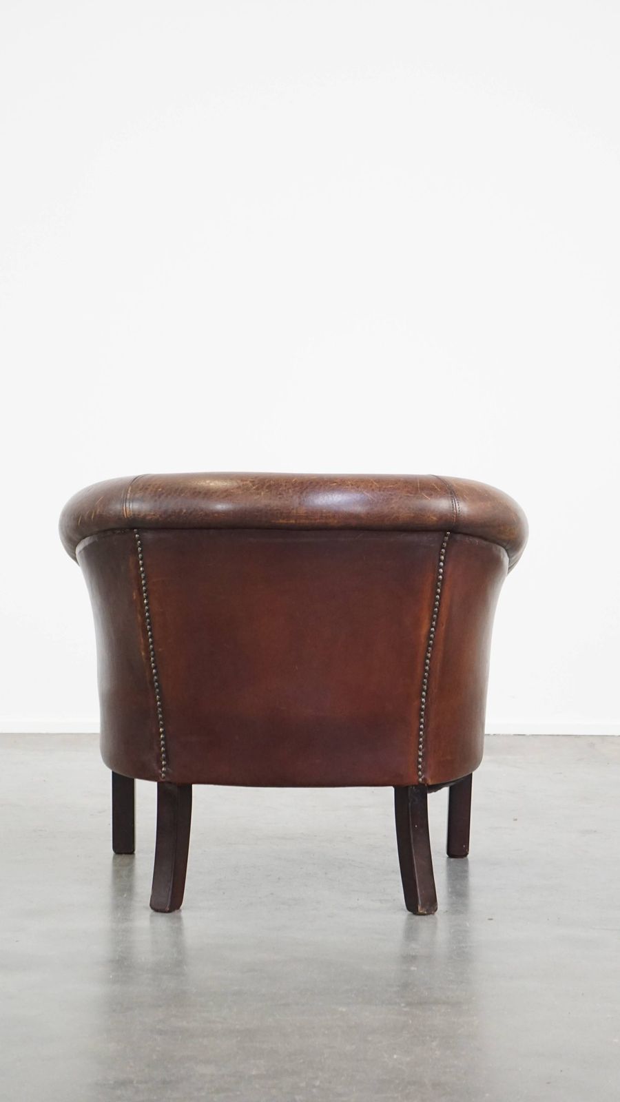 Subtle Sheepskin Club Chair With A Robust Appearance And Neatly Finished With Decorative Nails photo Furniture