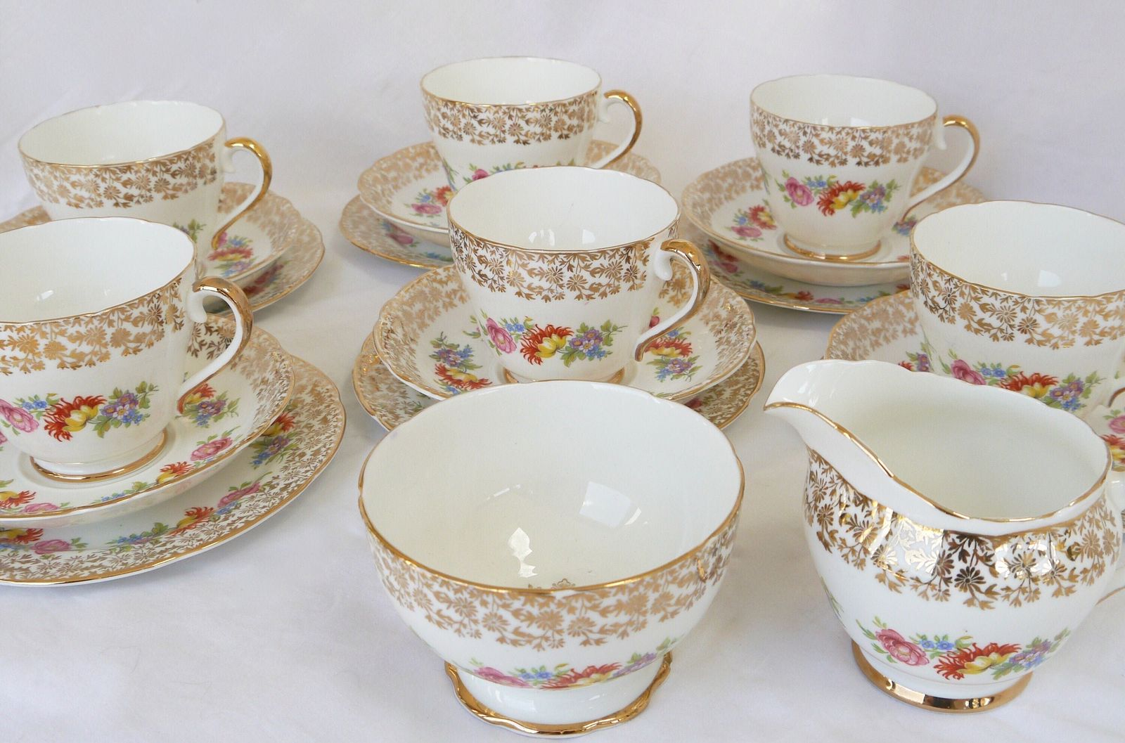 Imperial Bone China Tea Cup Trios With Milk Jug And Sugar Bowl, 6 Bone China Floral And Gold Tea Cups, Saucers And Plates. photo 89.0