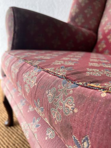 photo vintage Large Comfortable Antique Wingback Chair With Clean Grey Coloured Loose Covers