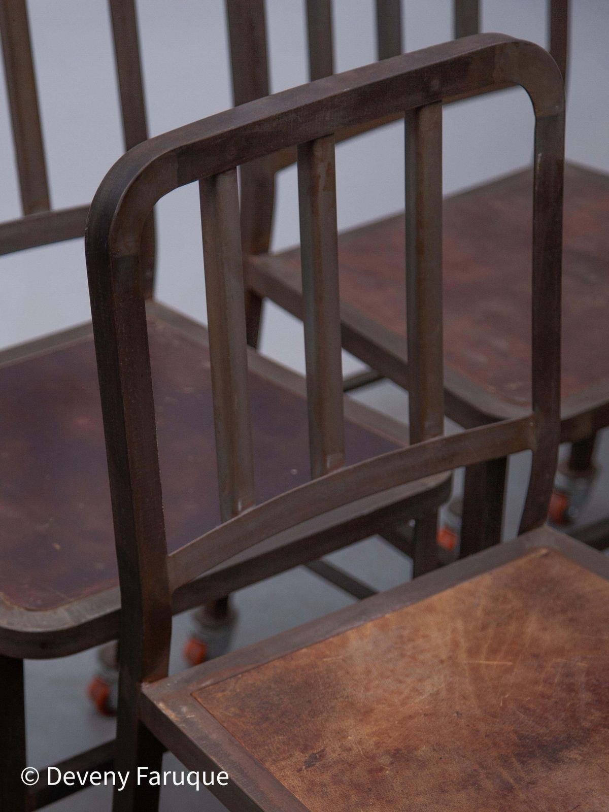 photo vinterior Vintage Set Of Six Emeco Navy Industrial Iron Chairs On Wheels With Wooden Seat