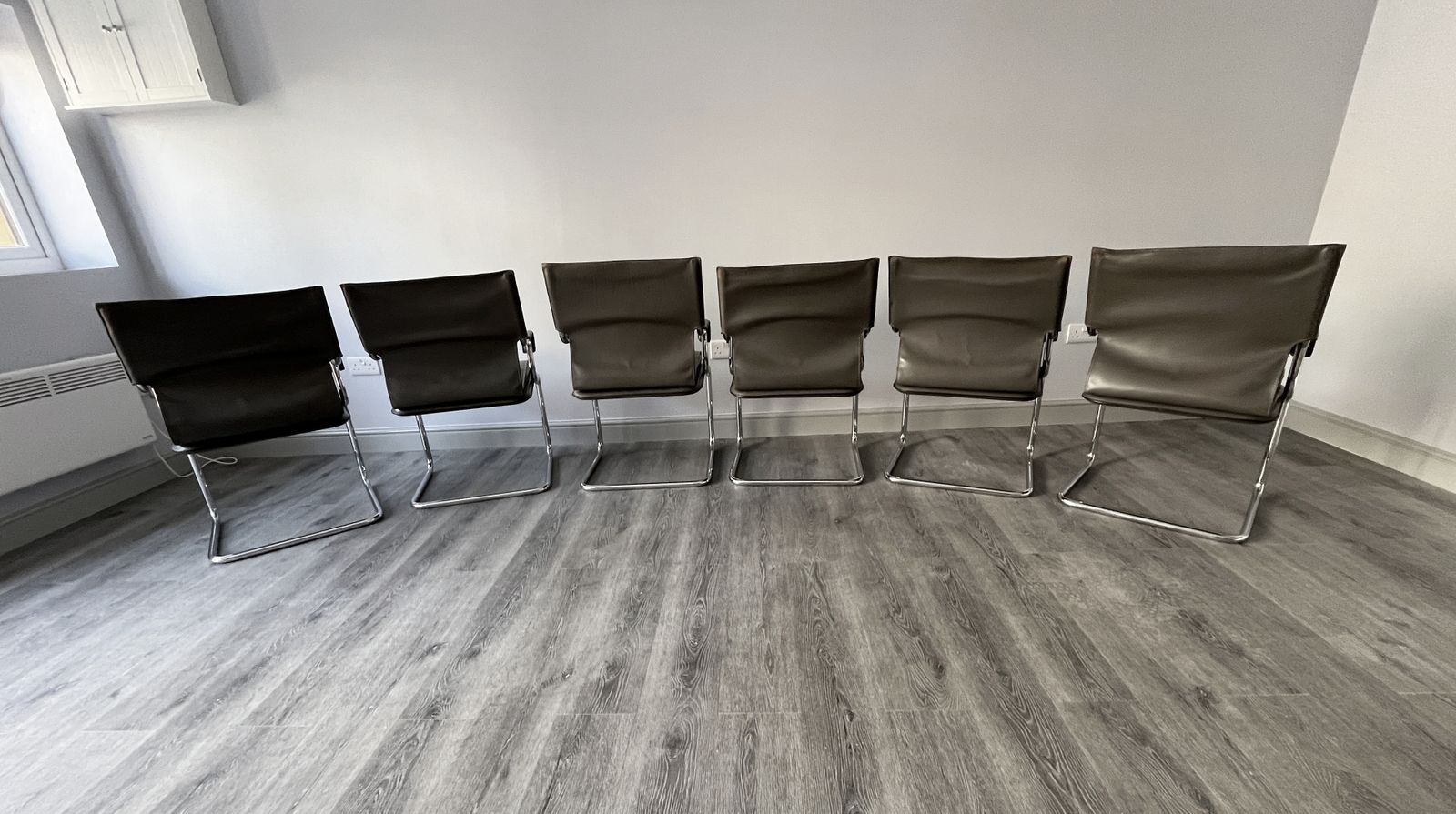 Set Of 6 Iconic Uno Chairs In Hand Stitched Heavy Grey Leather On Tubular Chrome Metal Cantilevered Frames. photo for sale