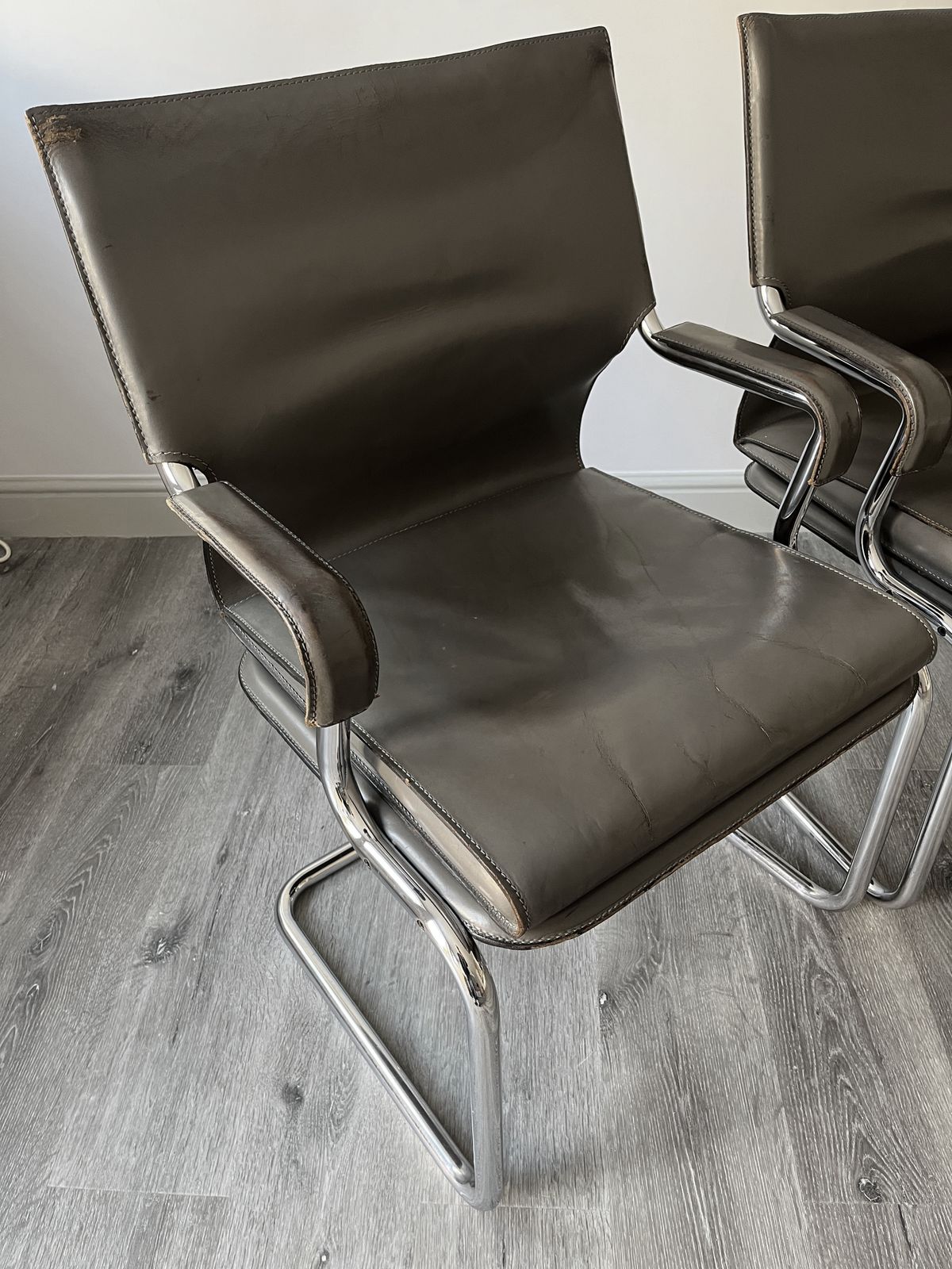 photo for sale Set Of 6 Iconic Uno Chairs In Hand Stitched Heavy Grey Leather On Tubular Chrome Metal Cantilevered Frames.