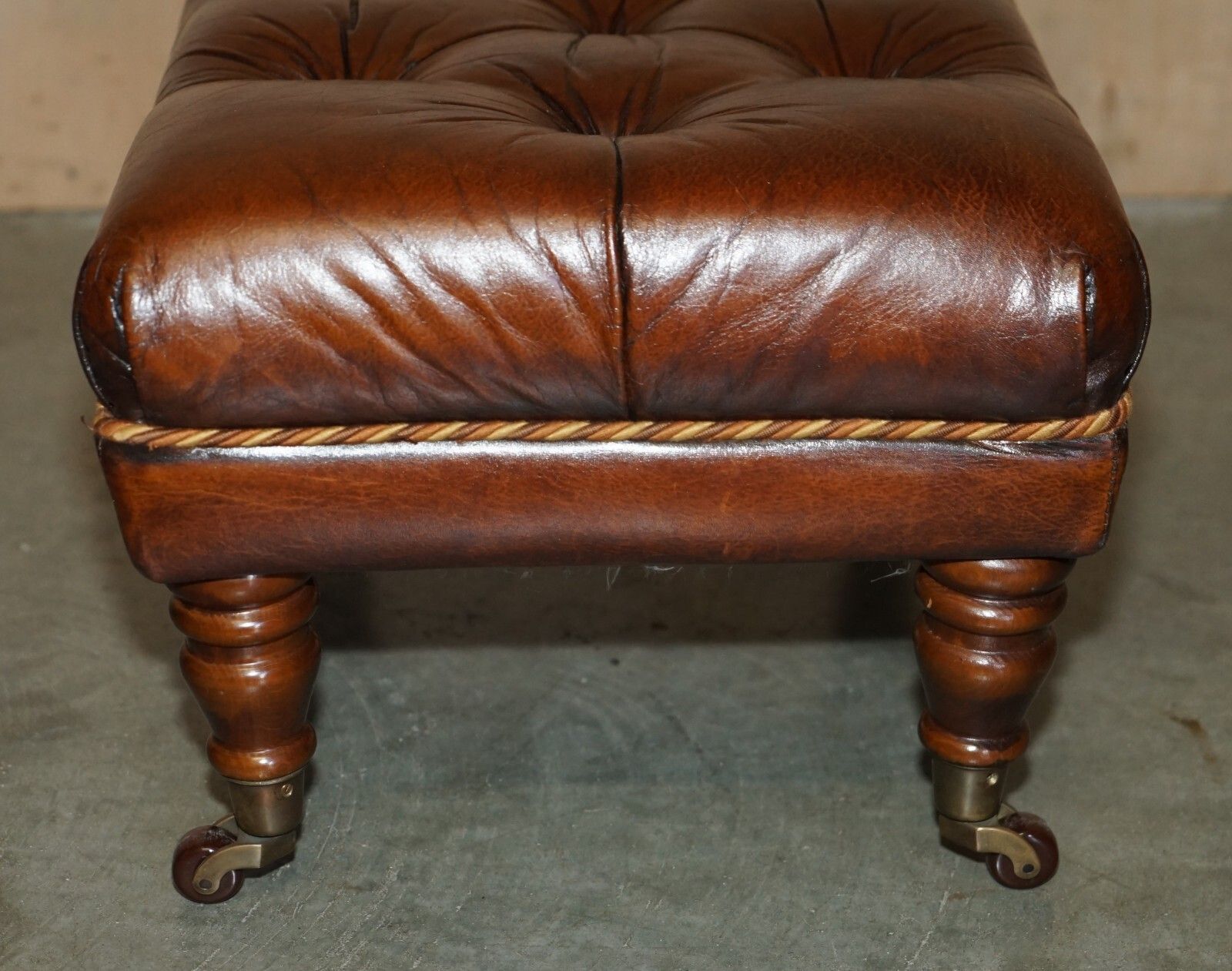 photo for sale Pair Of Restored Brown Leather Chesterfield Tufted Porcelain Castors Footstools