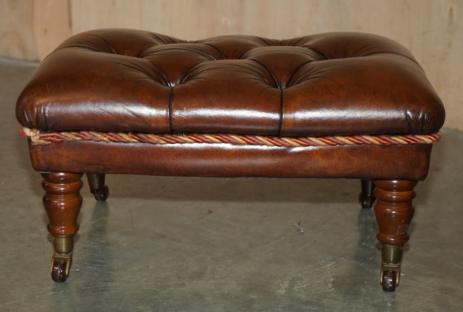 photo vinterior Pair Of Restored Brown Leather Chesterfield Tufted Porcelain Castors Footstools
