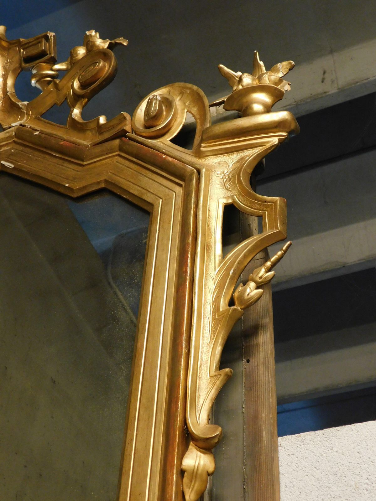 photo for sale Large Gilded Wooden Mirror With Carved Top Centered By A Coat Of Arms, Italy