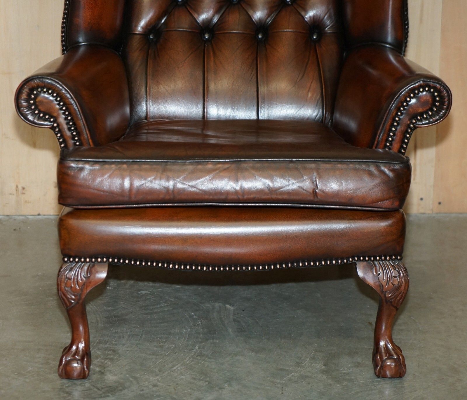 photo furniture Pair Of Claw & Ball Feet Chesterfield Tufted Brown Leather Wingback Armchairs