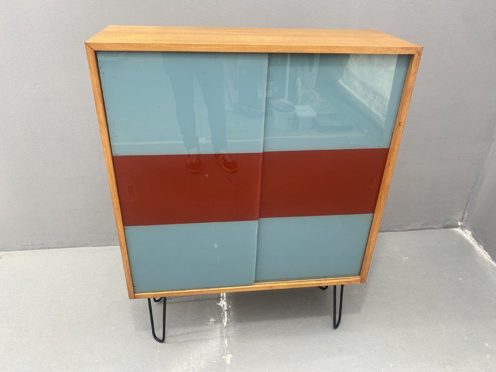 Dřevotvar Hradec Králové Cabinet With Metal Legs And Colored Glass