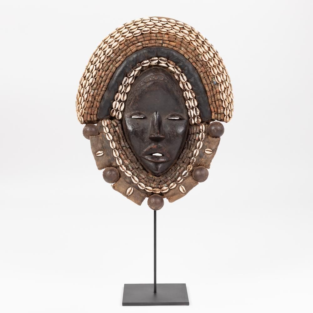 African Dan Yakuba Guard Mask Small Shells And Bells From The Ivory Coast 1970s photo furniture