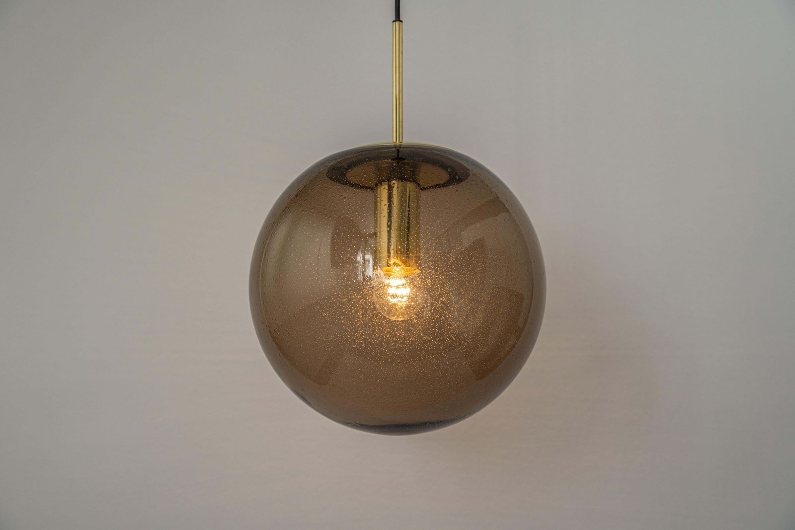 photo for sale Large Limburg Brass With Smoked Glass Ball Pendant, Germany, 1970s