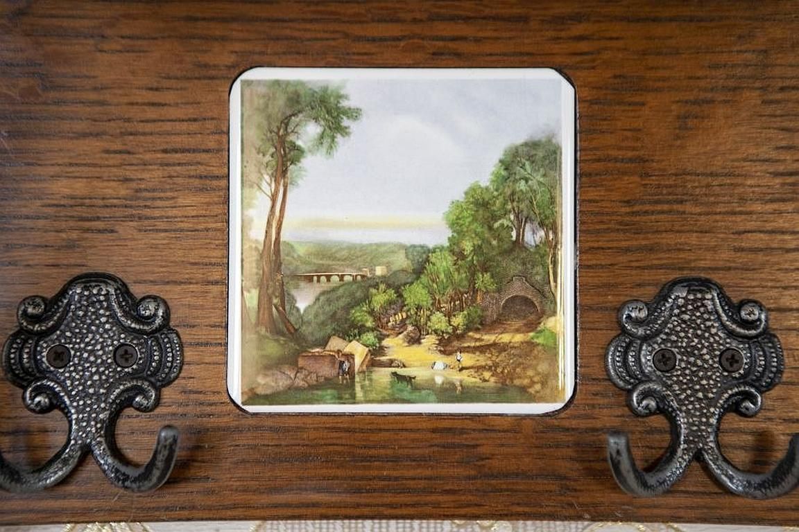 355.0 Dutch Oak Wall Coat Rack With Decorative Tiles From The Early 20th Century photo