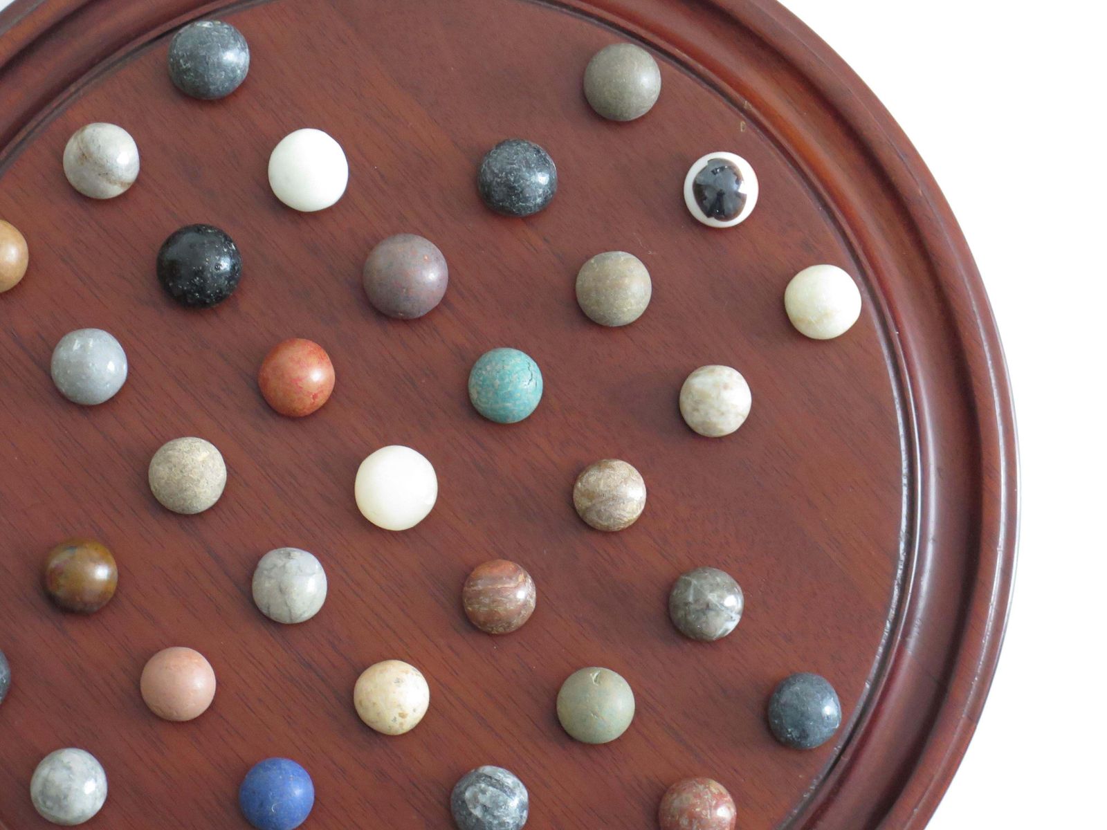 photo furniture Marble Solitaire Game 10 Inch Hardwood Board 35 Mixed Stone Marbles, Circa 1945