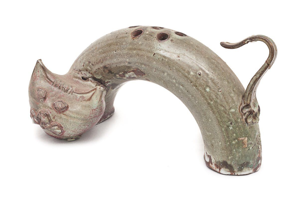 Ceramic Representing A Stylized Cat. photo furniture