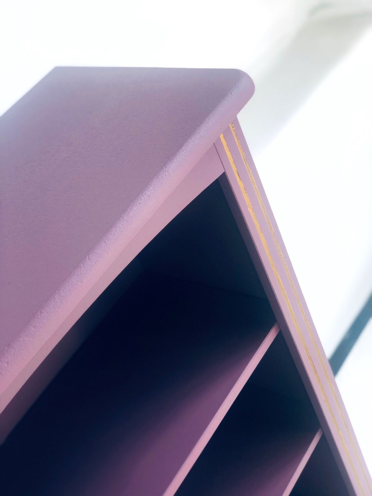 Painted Purple Bookshelf With Gold Trim Detail photo furniture