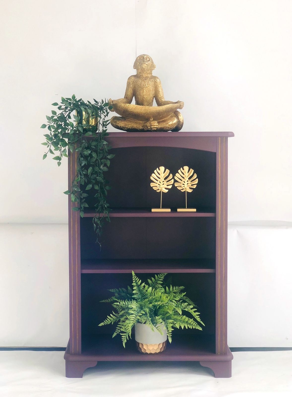 Painted Purple Bookshelf With Gold Trim Detail