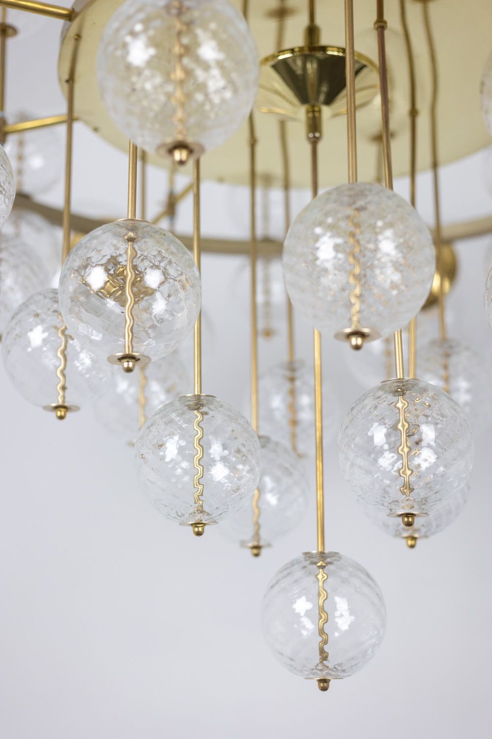 Large Chandelier In Gilded Brass And Decorative Balls. 1970s. photo for sale