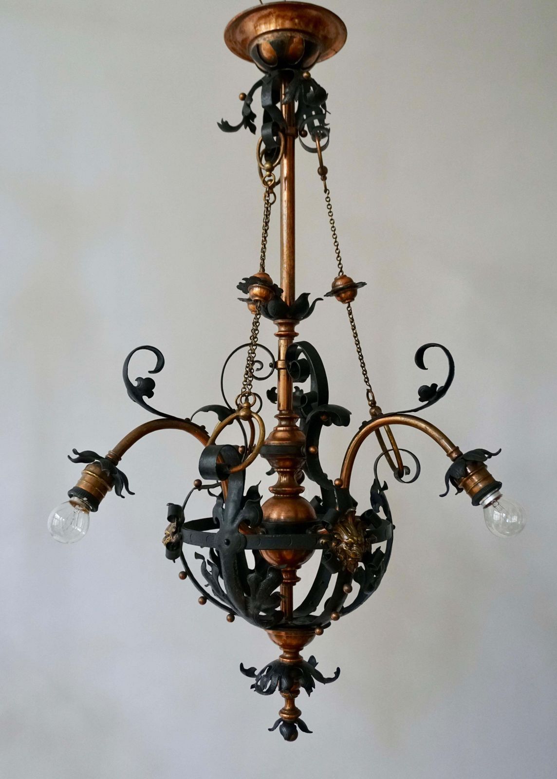 Arts & Crafts Wrought Iron And Copper Castle Chandelier With Bronze Lion Heads photo for sale