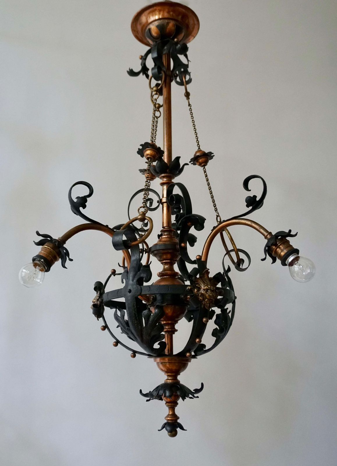 6369.0 Arts & Crafts Wrought Iron And Copper Castle Chandelier With Bronze Lion Heads photo
