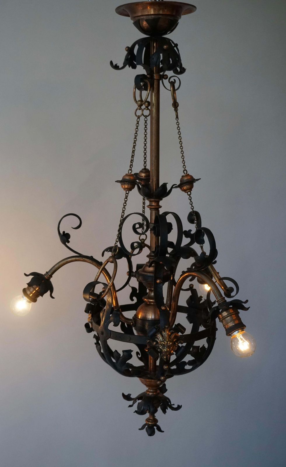 photo buy Arts & Crafts Wrought Iron And Copper Castle Chandelier With Bronze Lion Heads