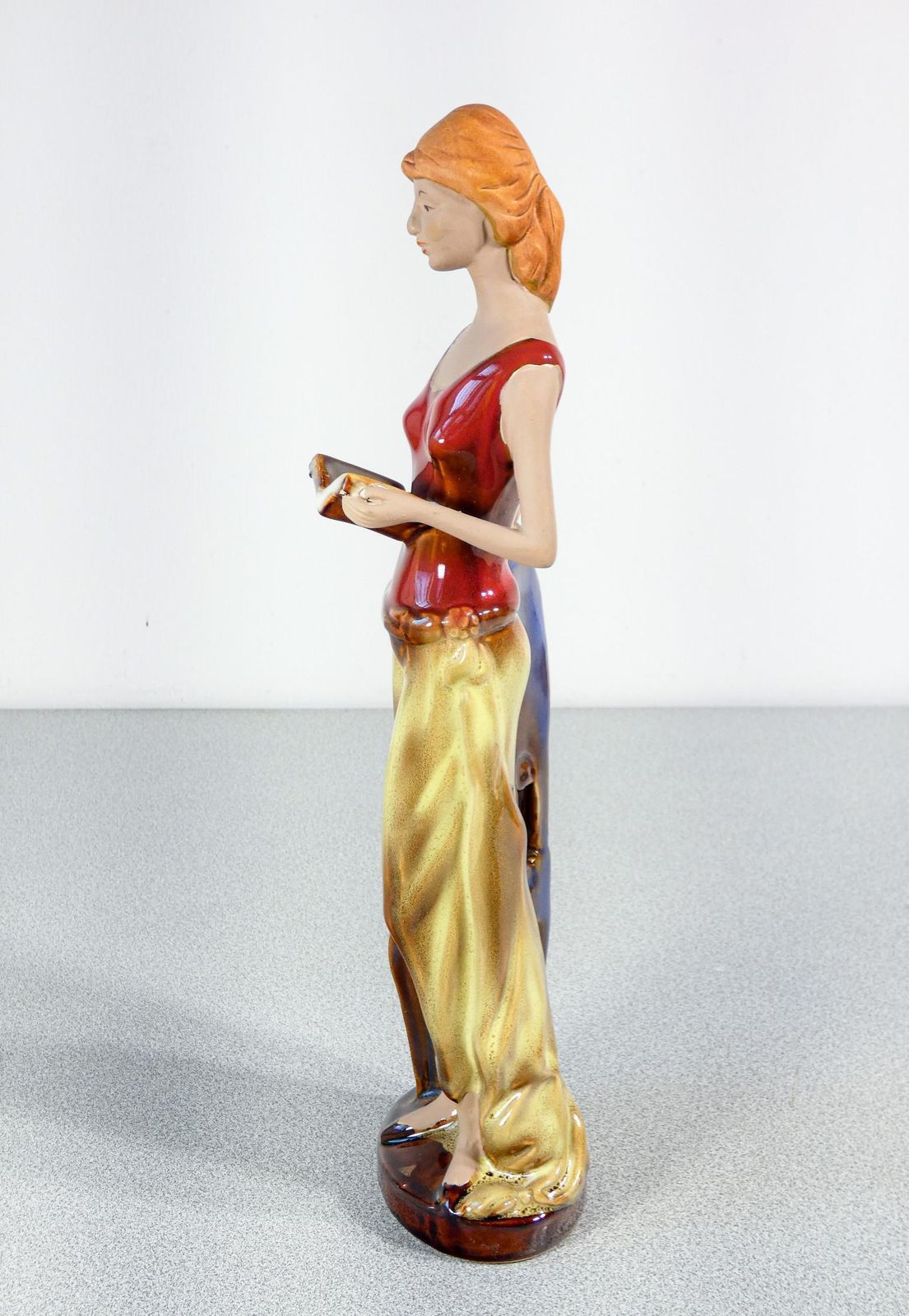 Painted And Glazed Ceramic Sculpture. Woman With Books. Italy photo vintage