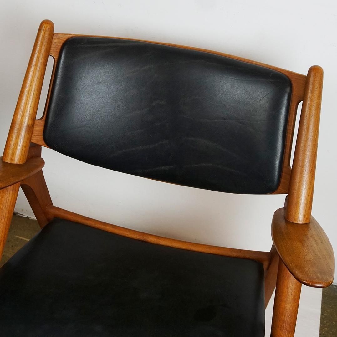 Scandinavian Teak And Black Leather Ch28 Chair By Hans Wegner For Carl Hansen photo for sale