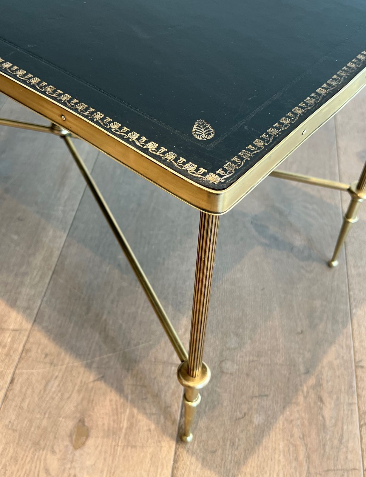 photo furniture Neoclassical Style Brass Coffee Table With Black Leather Top And Gold Trim From Maison Jansen