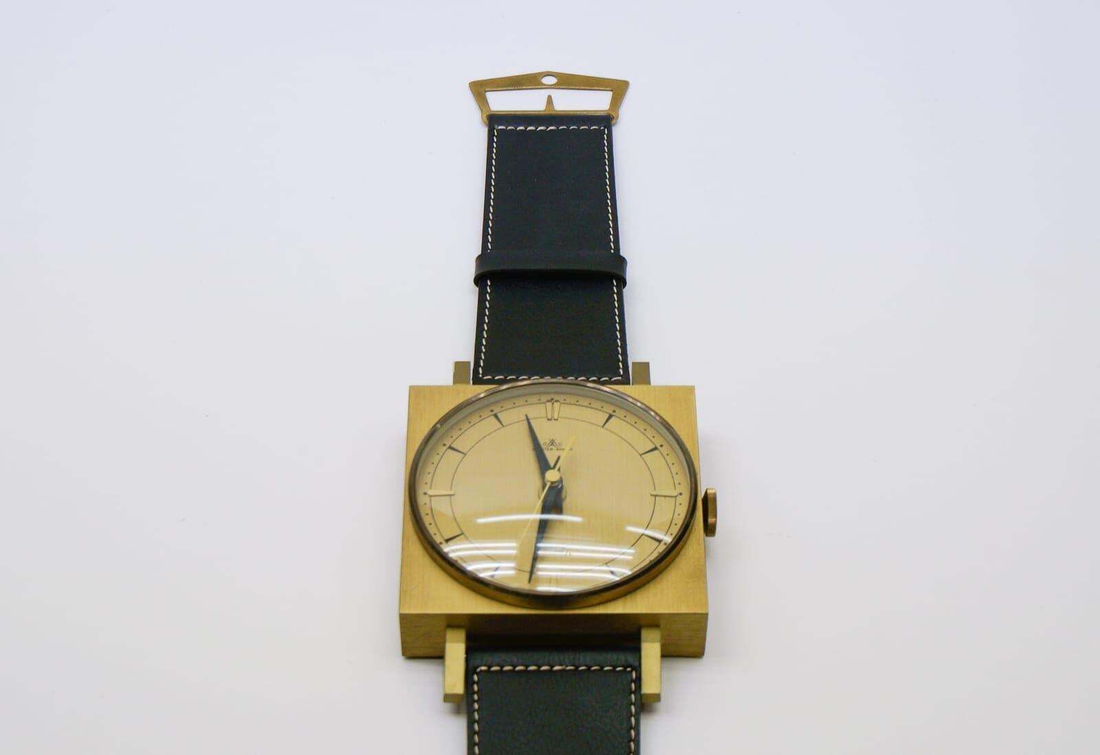 Midcentury Wall Clock In The Form Of A Wristwatch In Leather And Brass, Germany photo for sale