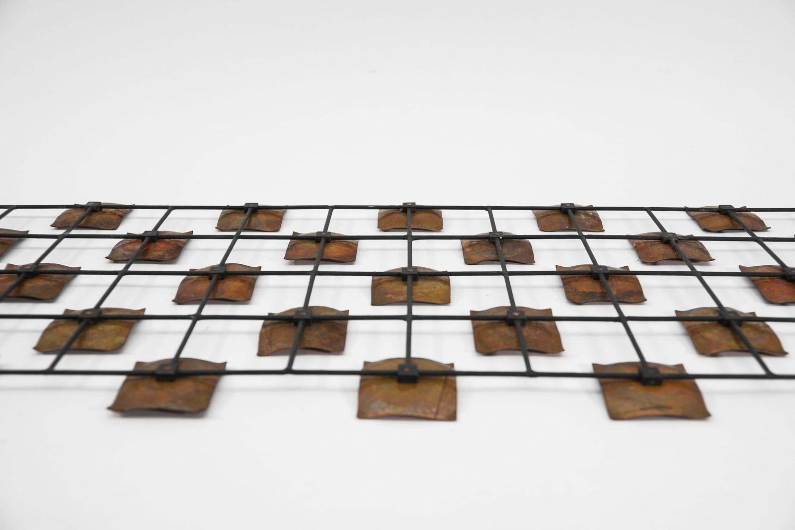 photo furniture Hang Finished Artist Mural Made Of Copper Elements On A Metal Lattice Frame