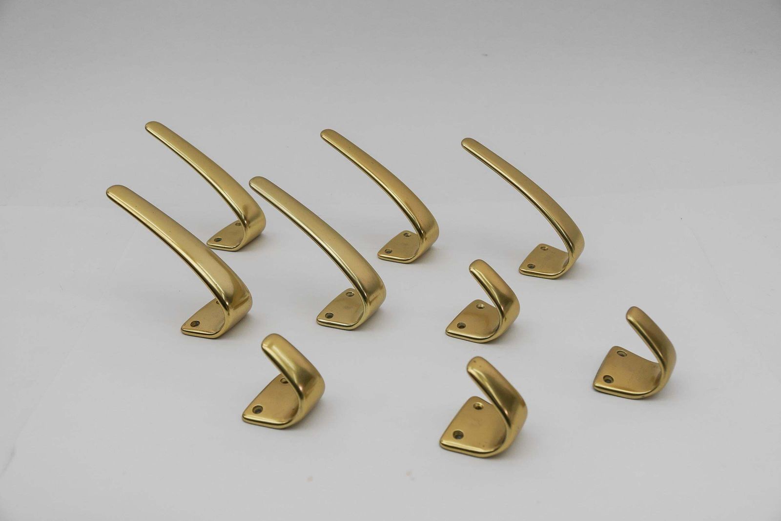 photo furniture Set Of 18 Midcentury Brass Wall Hooks, Austria, 1950s