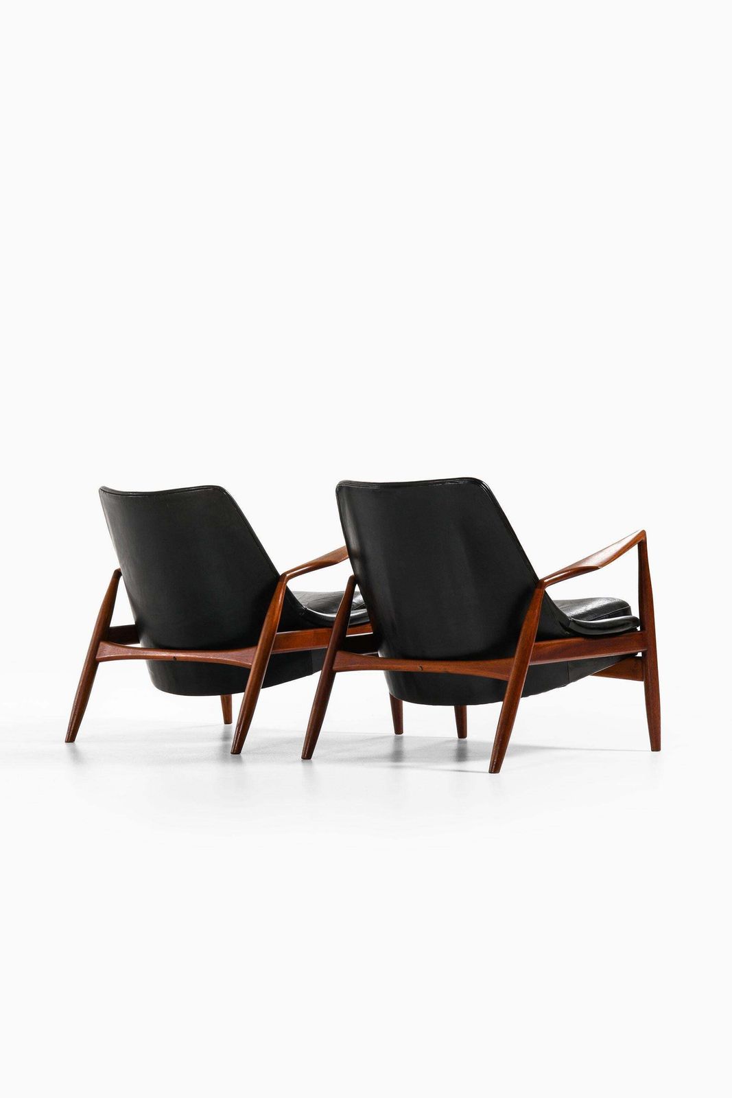 Pair Of Easy Chairs In Teak And Original Black Leather By Ib Kofod Larsen photo for sale