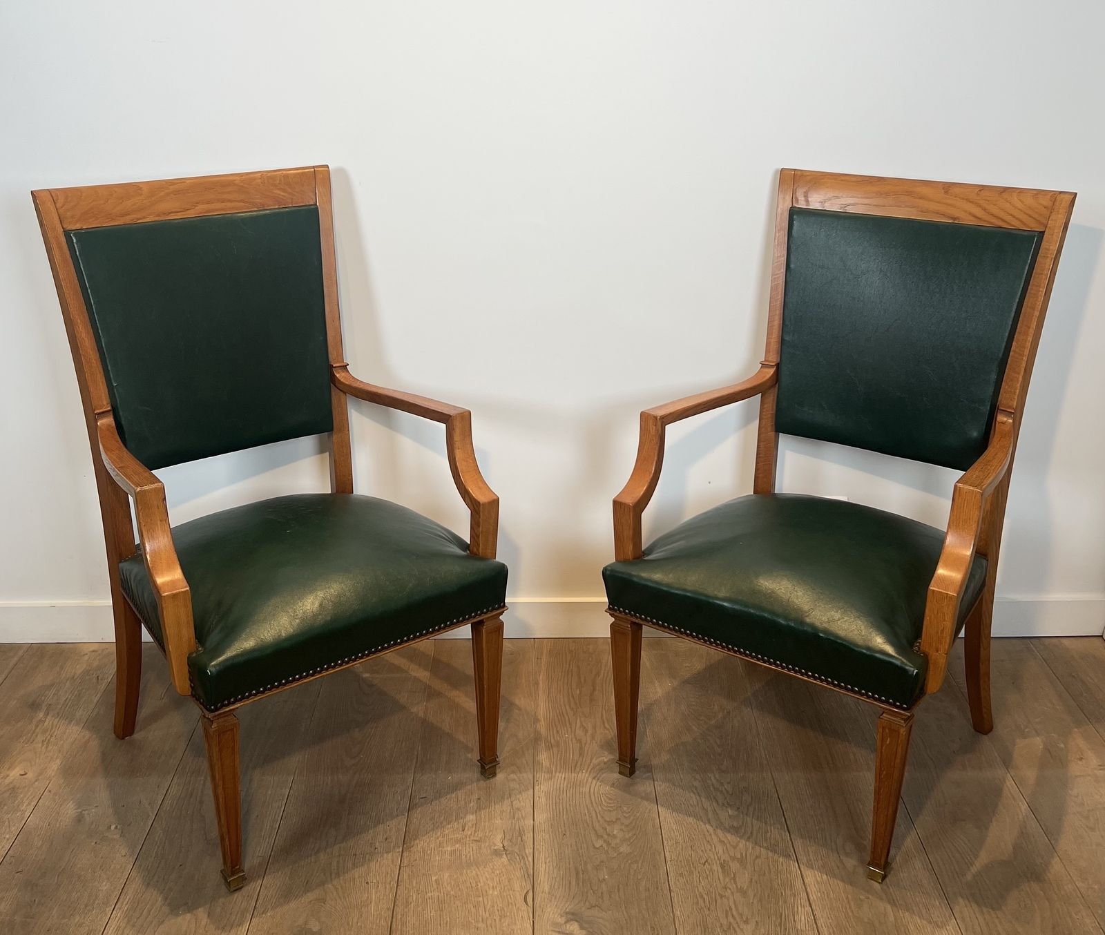4950.0 Pair Of Art Deco Oak And Leather Armchairs By De Coene Frères photo