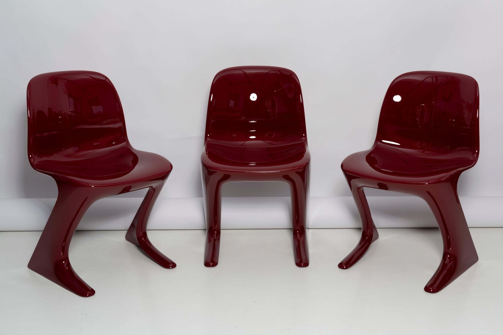 Set Of Six Red Wine Kangaroo Chairs Designed By Ernst Moeckl, Germany, 1968 photo for sale