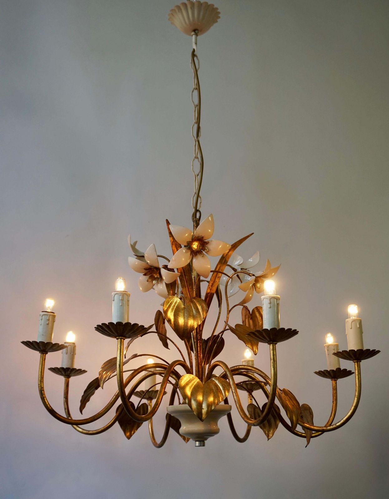 Chandelier With Golden Leaves And White Flowers photo for sale