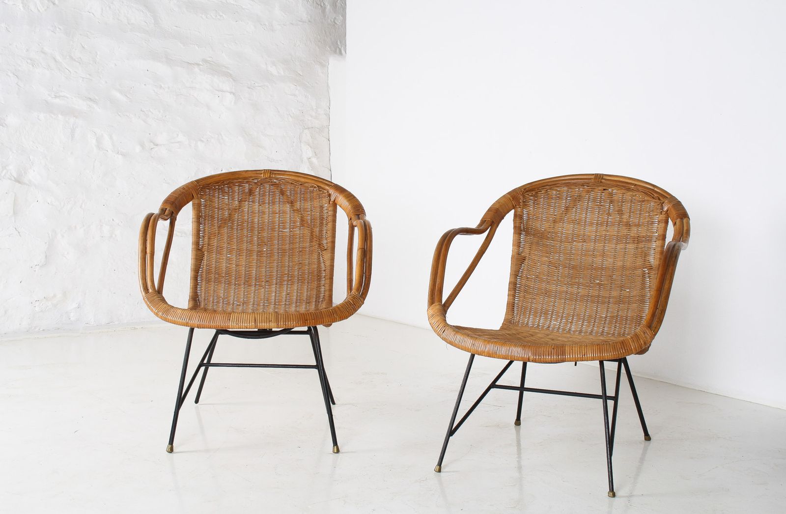 Furniture A Pair Of 1950s Mid Century Rattan Basket Chairs In The Manner Of Arthur Umanoff photo