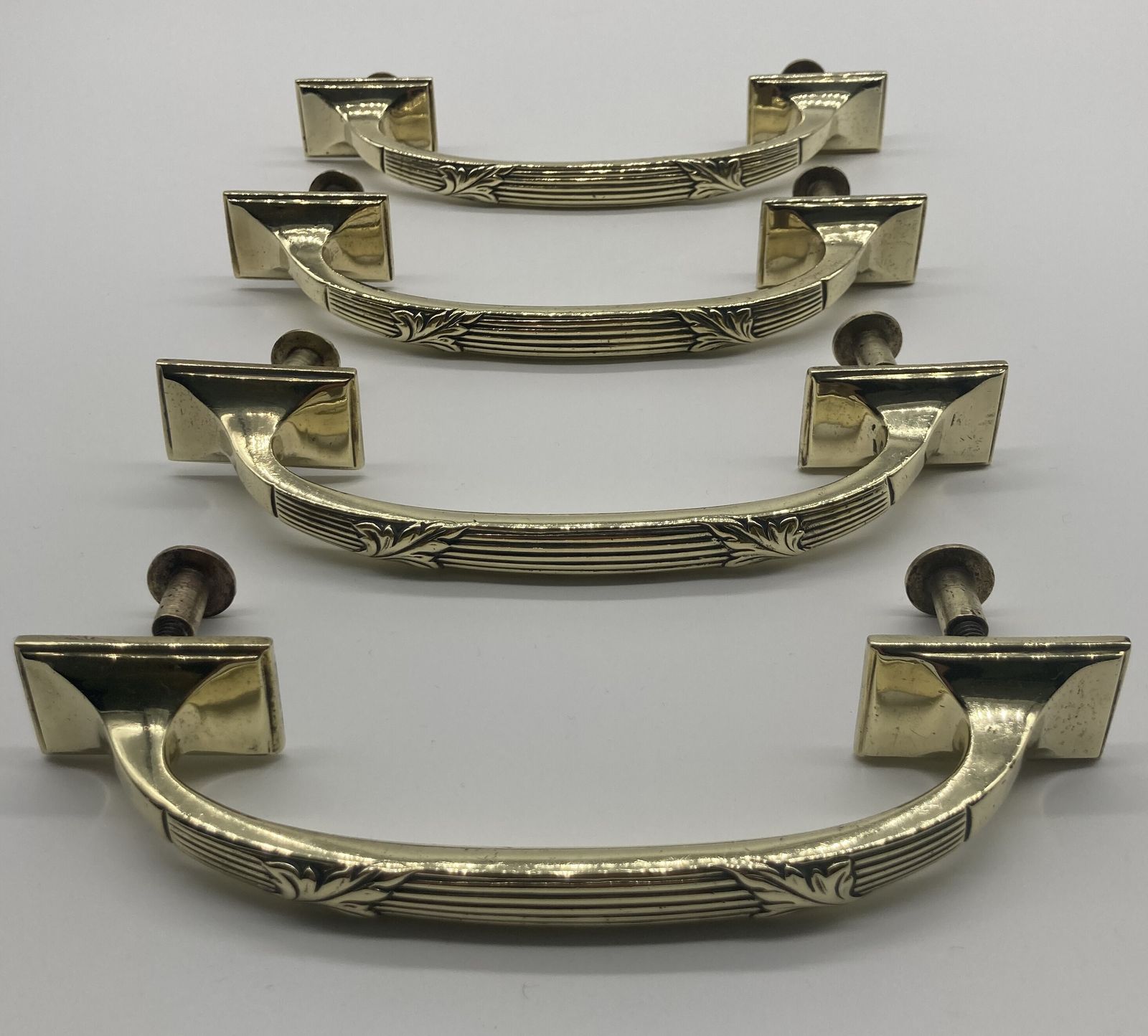 A Set Of Four Brass Handles By William Tonks And Sons