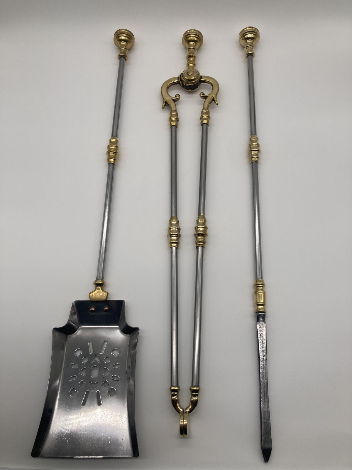 A Set Of Steel And Brass Victorian Fire Irons