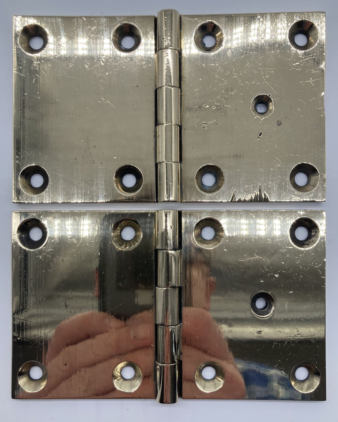 A Pair Of Square Brass Door Hinges