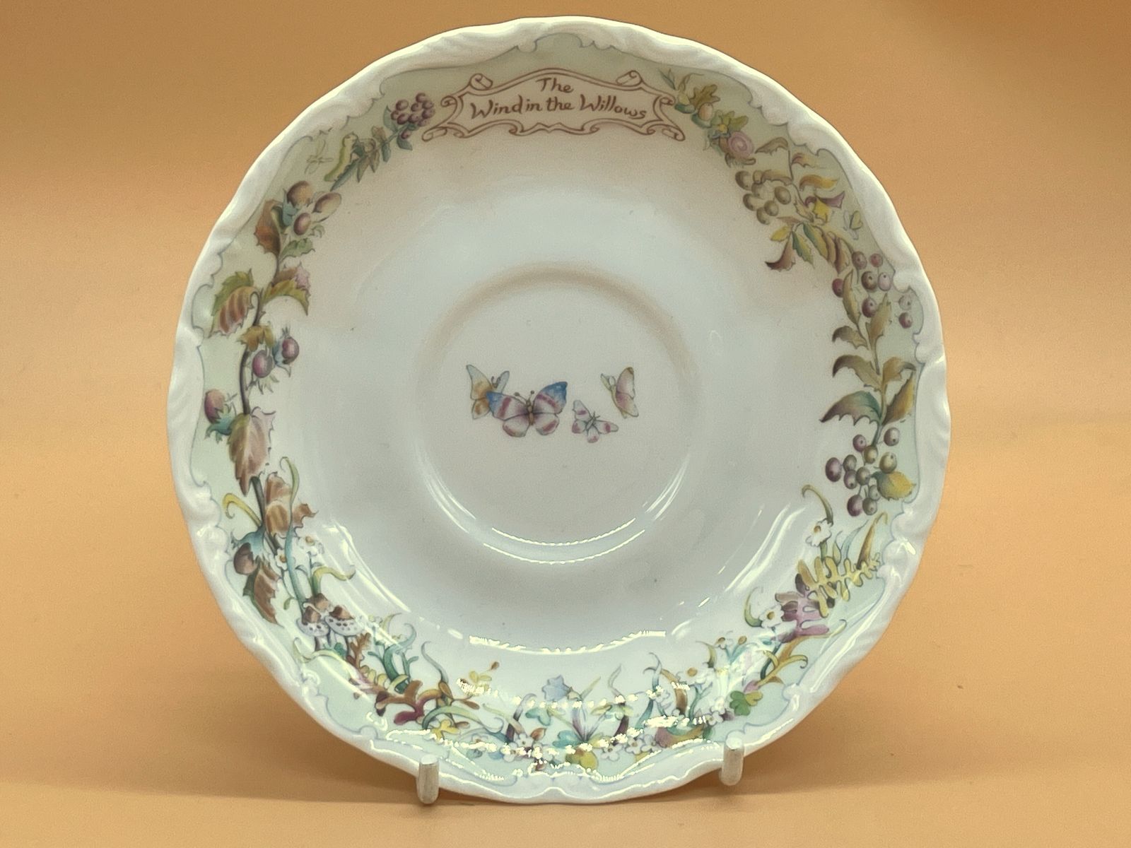 photo furniture Royal Albert China Wind In The Willows Autumn In Wild Wood Design Tea Cup, Saucer & Side Plate Trio. C1987.