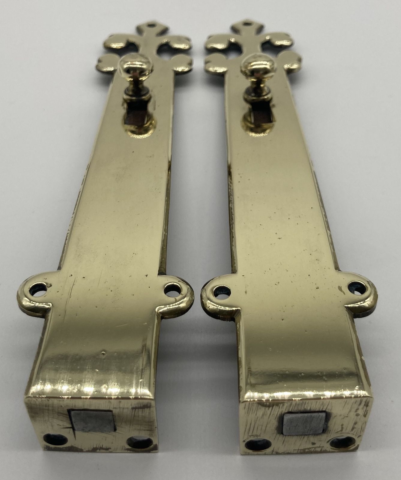 A Pair Of Small Brass Door Shut Bolts photo for sale