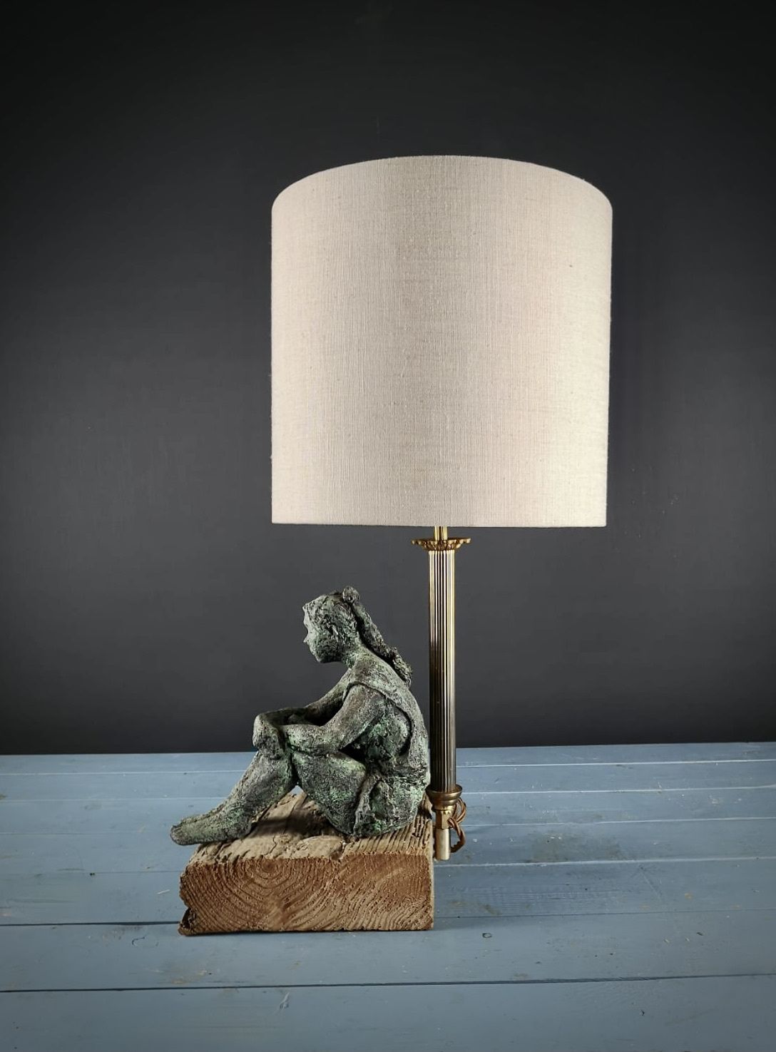 Girl Resting On Wood. Bespoke One Of A Kind Lamp, Designed By John Mangan.