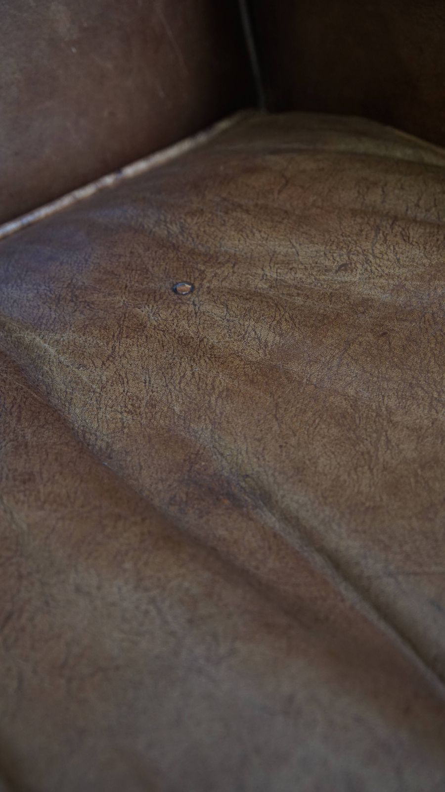 photo for sale Charming, Timeless And Characterful Cowhide Wing Chair In A Light Cognac Color Finished With A Matching Piping