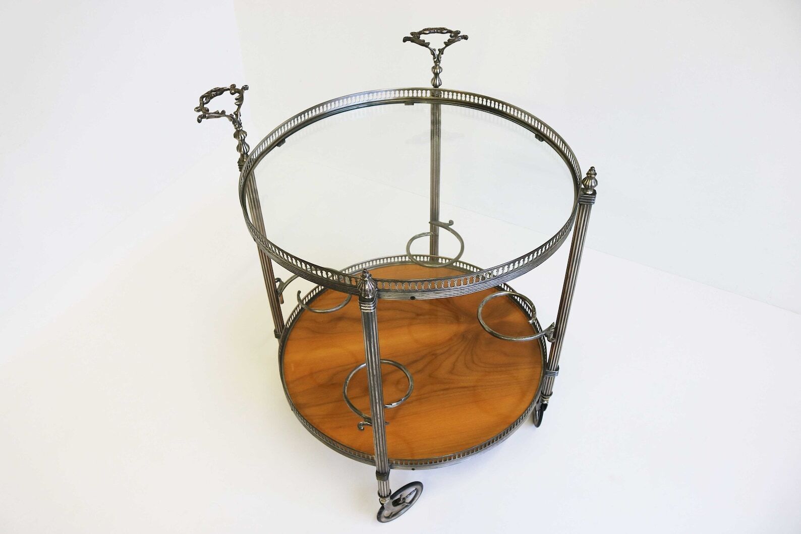 Mid Century Round Silver Bar Cart Clear Glass And Wood Four Bottle Holders And Two Handles Vintage Serving Trolly Tea Cart Side Table 1950s photo for sale