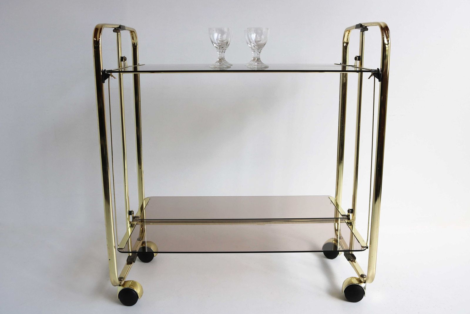 Midcentury Golden Foldable Barcart Teacart Cocktailcart Brass Entertainment Cart Hollywood Serving Cart Display Cart Smoked Glass 1970 photo furniture