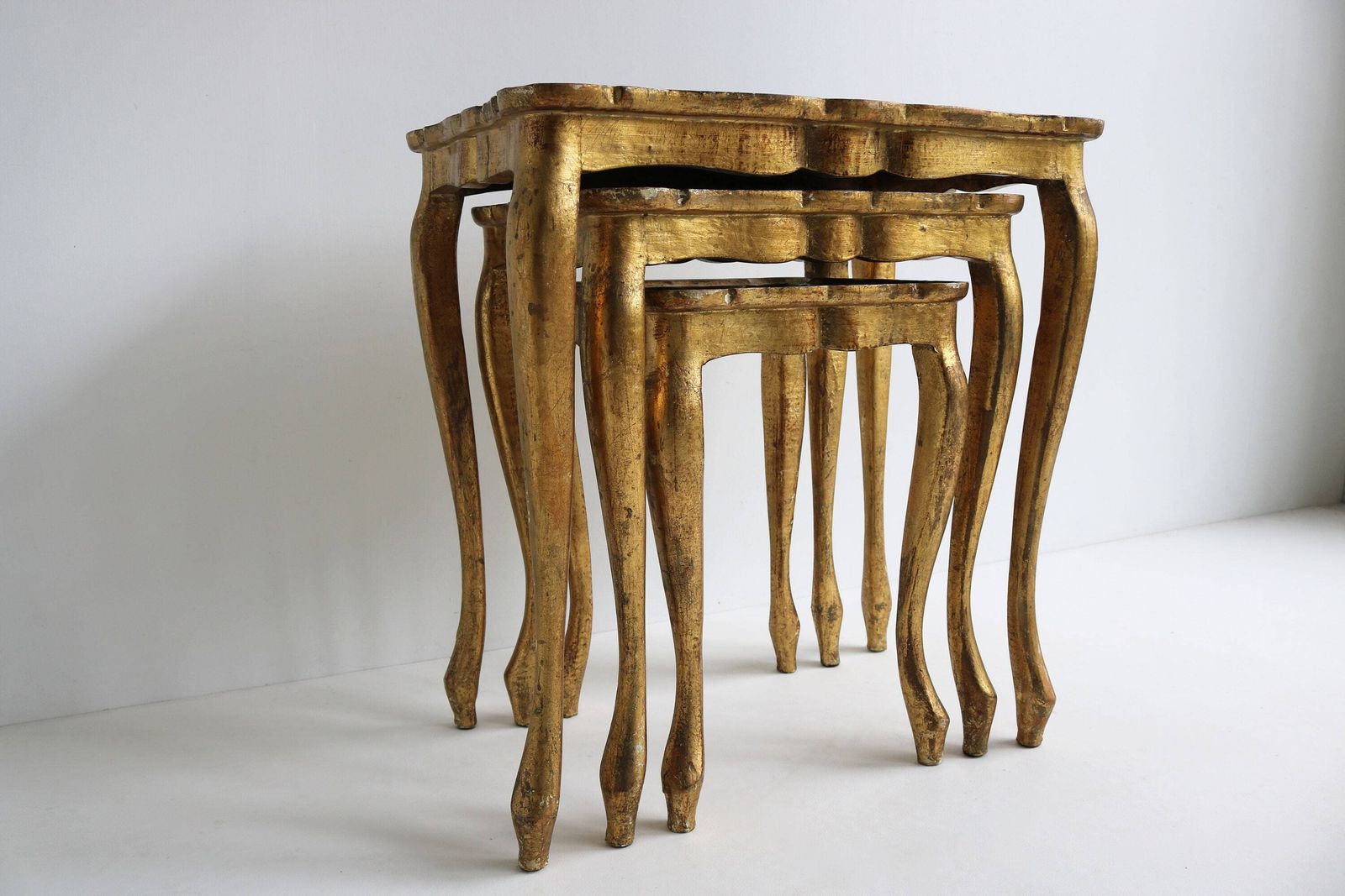 Set Of Three Italian Florentine Gold Hollywood Regency Wood Stacking Nesting Tables Additional Tables Side Tables Set Tables 1960s photo for sale