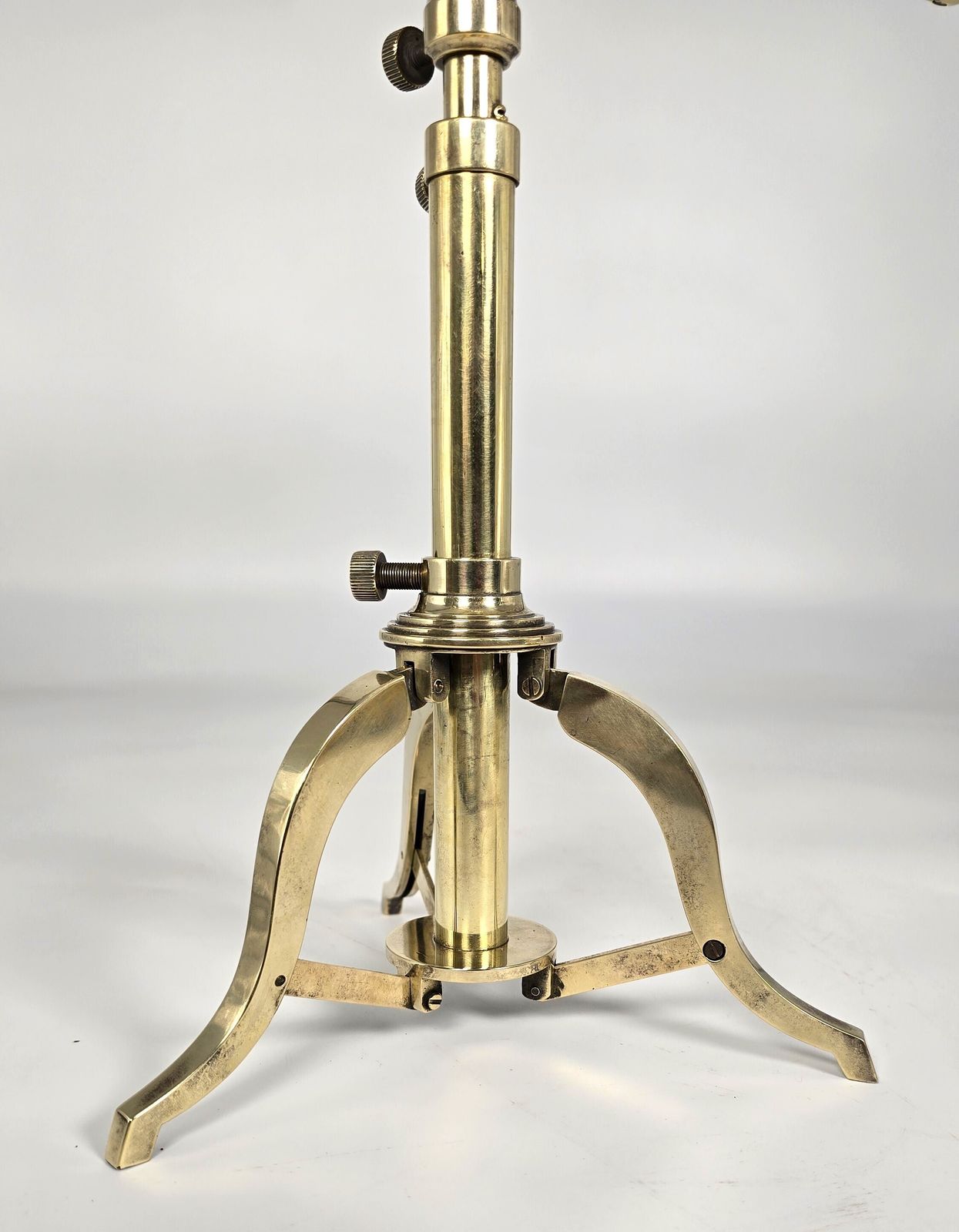 photo buy A Small Mid 19th Century Brass Telescope With An Original Folding Brass Tripod Stand.
