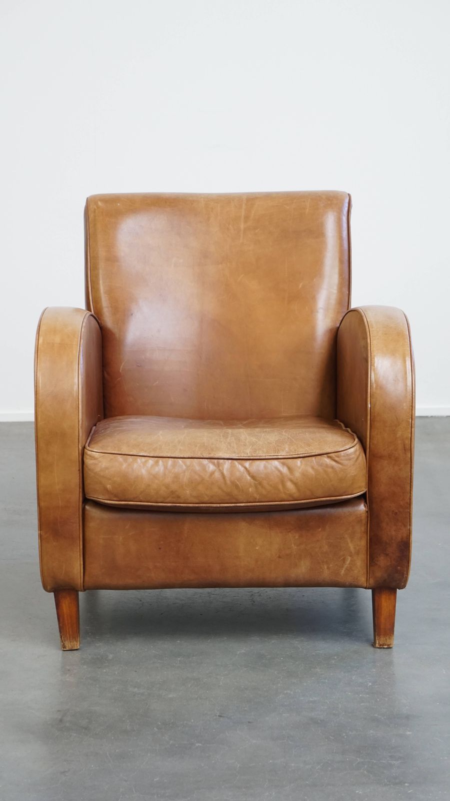 Beautiful, Sleekly Shaped Cowhide Designer Armchair In A Light Cognac Color photo furniture