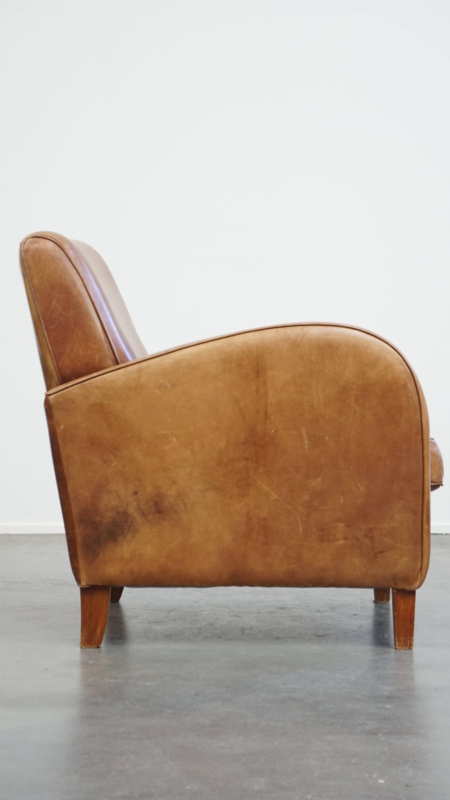Beautiful, Sleekly Shaped Cowhide Designer Armchair In A Light Cognac Color photo for sale