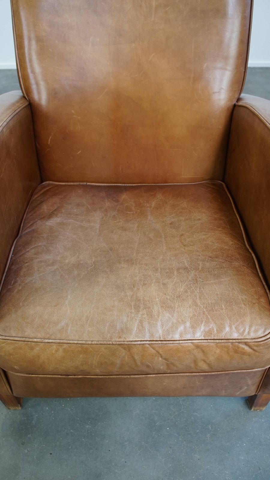 Beautiful, Sleekly Shaped Cowhide Designer Armchair In A Light Cognac Color photo vinterior