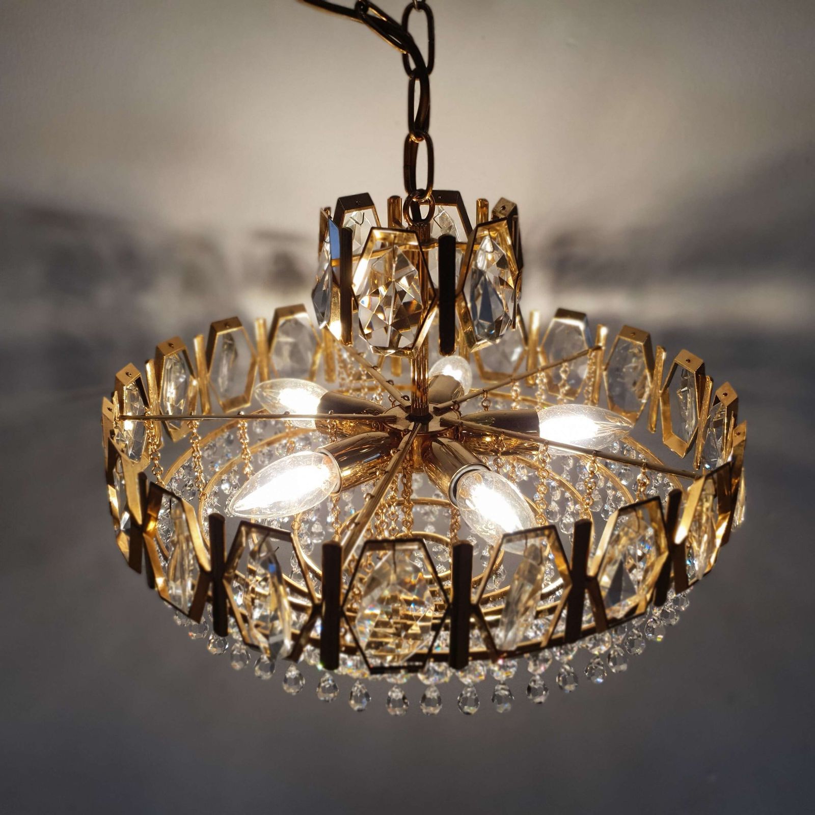 A Swedish Gilded Metal & "Fantastic" Cut Glass Chandelier. 1960s. photo for sale