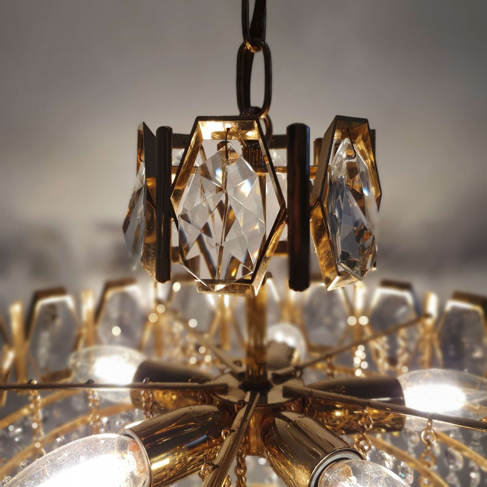 A Swedish Gilded Metal & "Fantastic" Cut Glass Chandelier. 1960s. photo Lighting